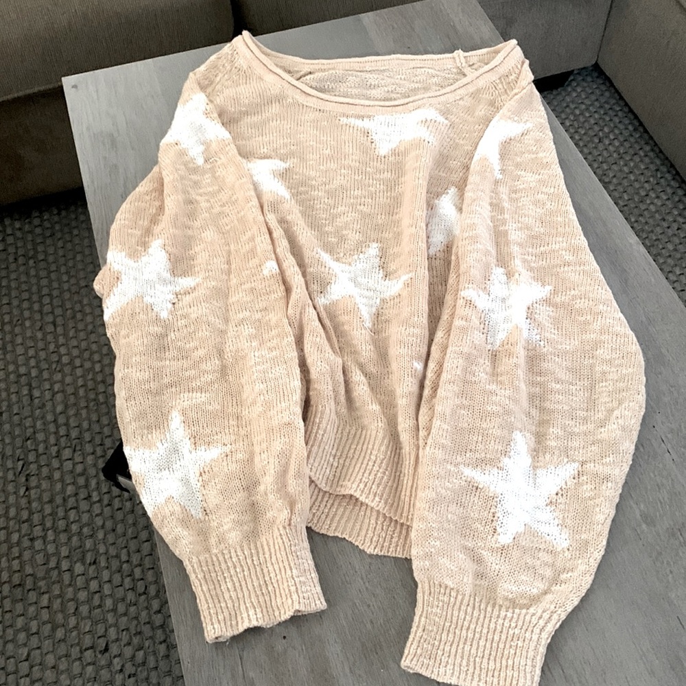 Light weight sweater with stars. sized fit.